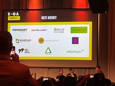 atlantis dx nominated for E-Commerce Germany Award Photo: Stage and screen with company logos
