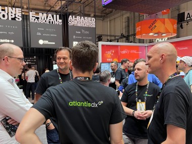 Photo: atlantis dx management in a circle at a meeting at OMR 2023
