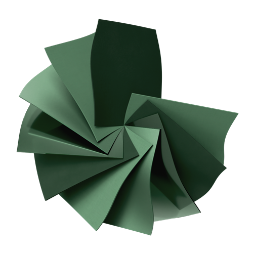 Eine spiralförmige Anordnung von grünen Papierstücken.